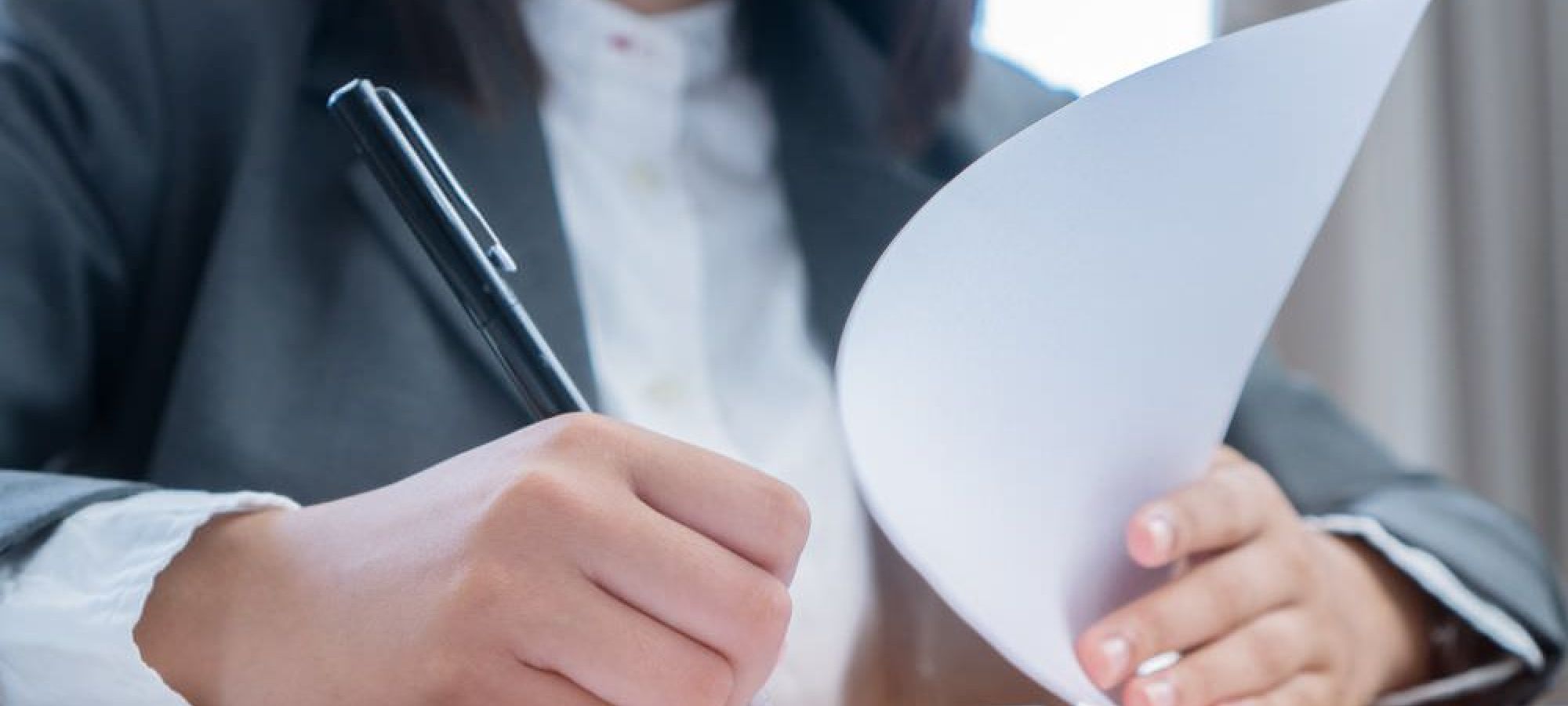 Person filling out paperwork