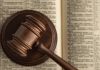 gavel on top of open book