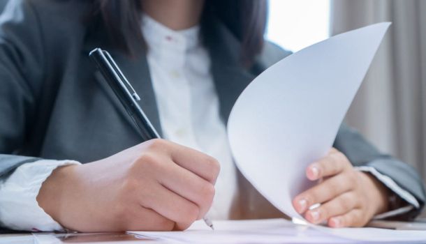 Person filling out paperwork