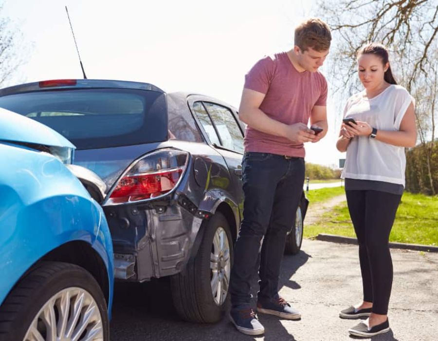 Two people exchanging info after auto accidenta